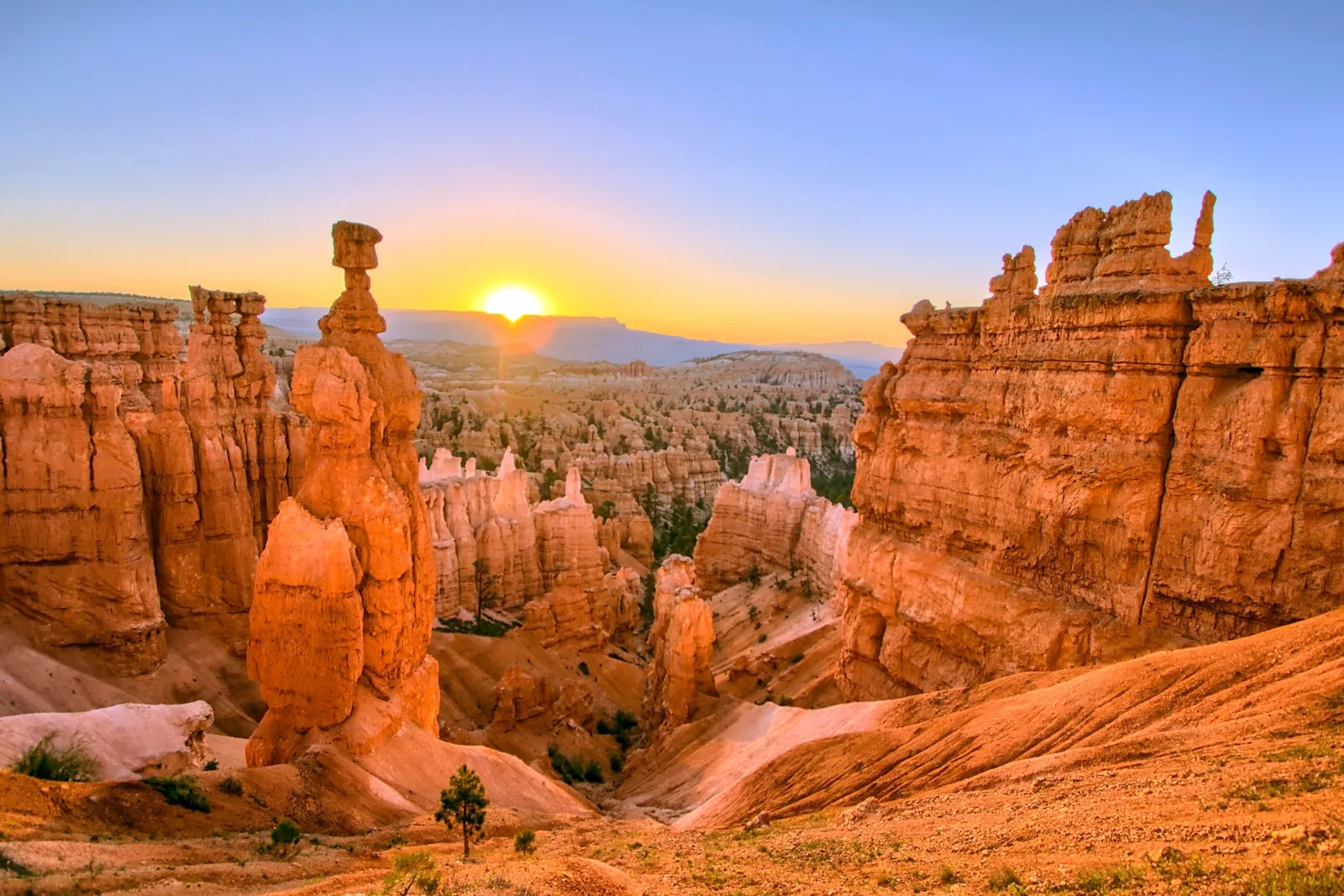 Thor's Hammer at Bryce Canyon lit orange by the rising sun