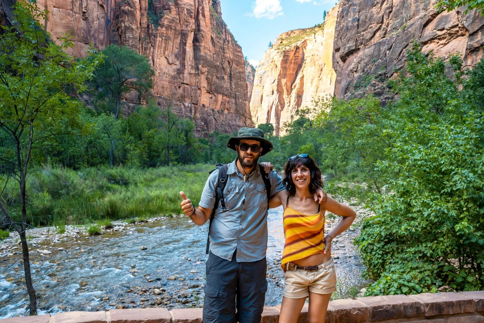 Two guests standing beside the Virgin River on the Riverside Walk trail
